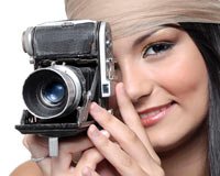Girl taking photos using digital camera